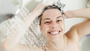 Woman Washing Hair Under Shower